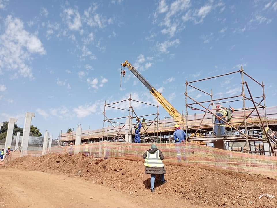 Mobile crane and scaffolding during structural works on a new development